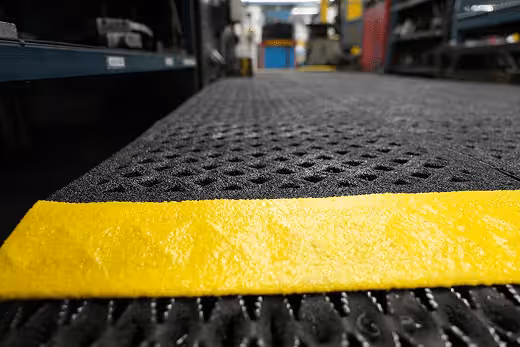 Anti-slip grit matting with drainage holes